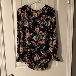 Besutuful floral long sleeve shirt. Size is small but fits more like a medium.